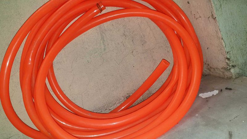 Durable Orange Hose for Various Uses