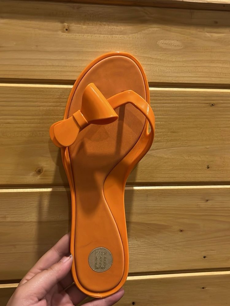 Melissa Orange Flip Flops with Bow Accent