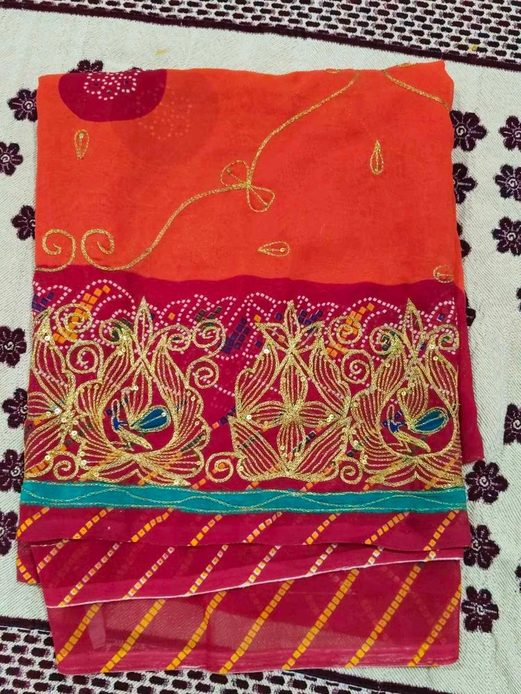 Vibrant orange rust coloured rajasthani odhni with