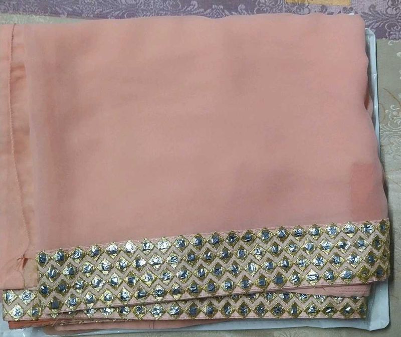 Elegant Peach Saree with Embellished Border
