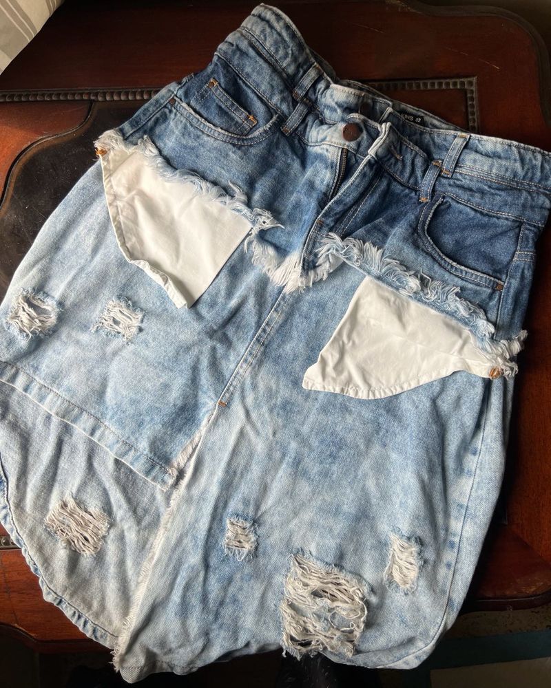 Y2K style distressed denim skirt