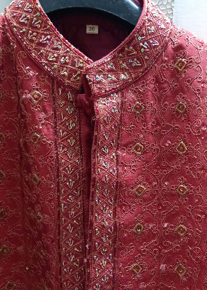 SHERWANI 36 SIZE RED COLOUR WITH HEAVY WORK IN IT FOR GRAND FUNCTIONS AND PARTIES READY TO USE CONDITION