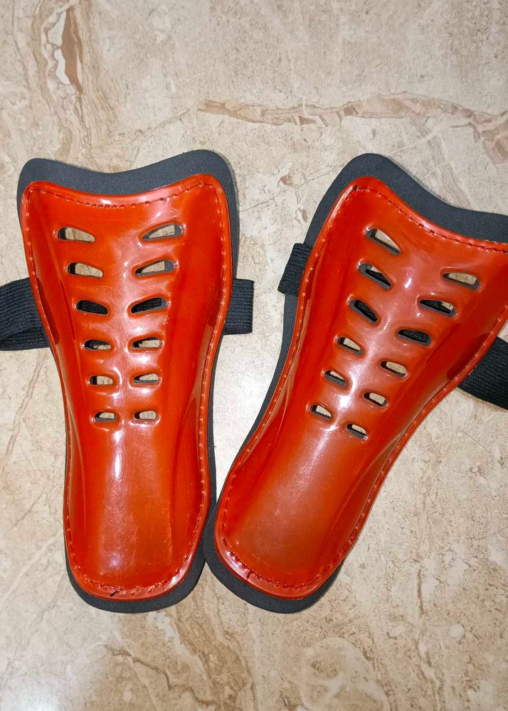Orange Shin Guards