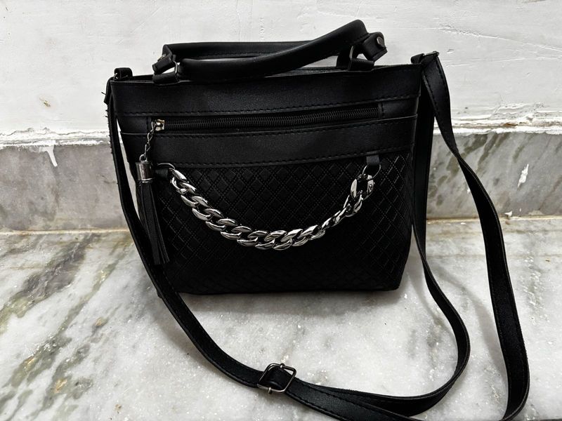 Chic Black Handbag with Chain Detail