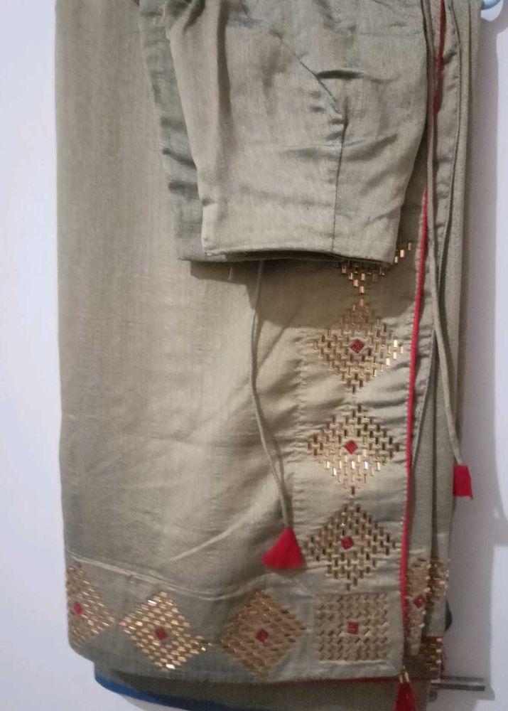 Elegant Beige Saree with Gold Embellishments