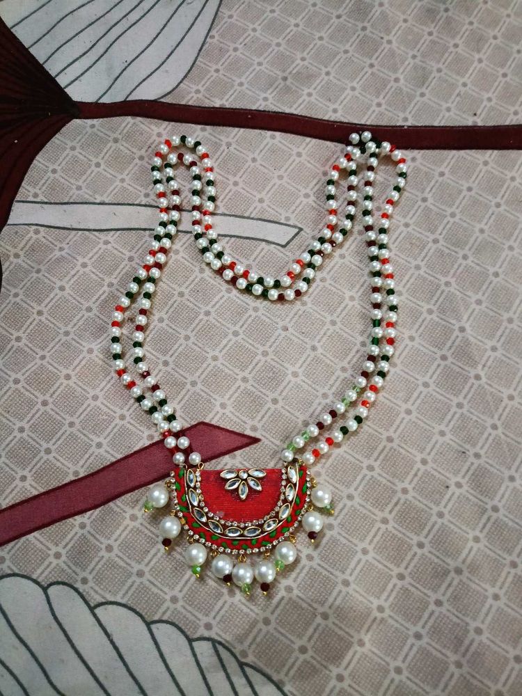 Elegant Beaded Necklace with Red Pendant
