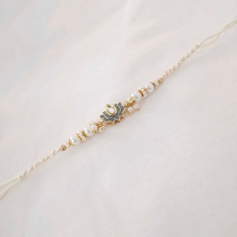 Elegant Pearl Rakhi with Lotus Pendant