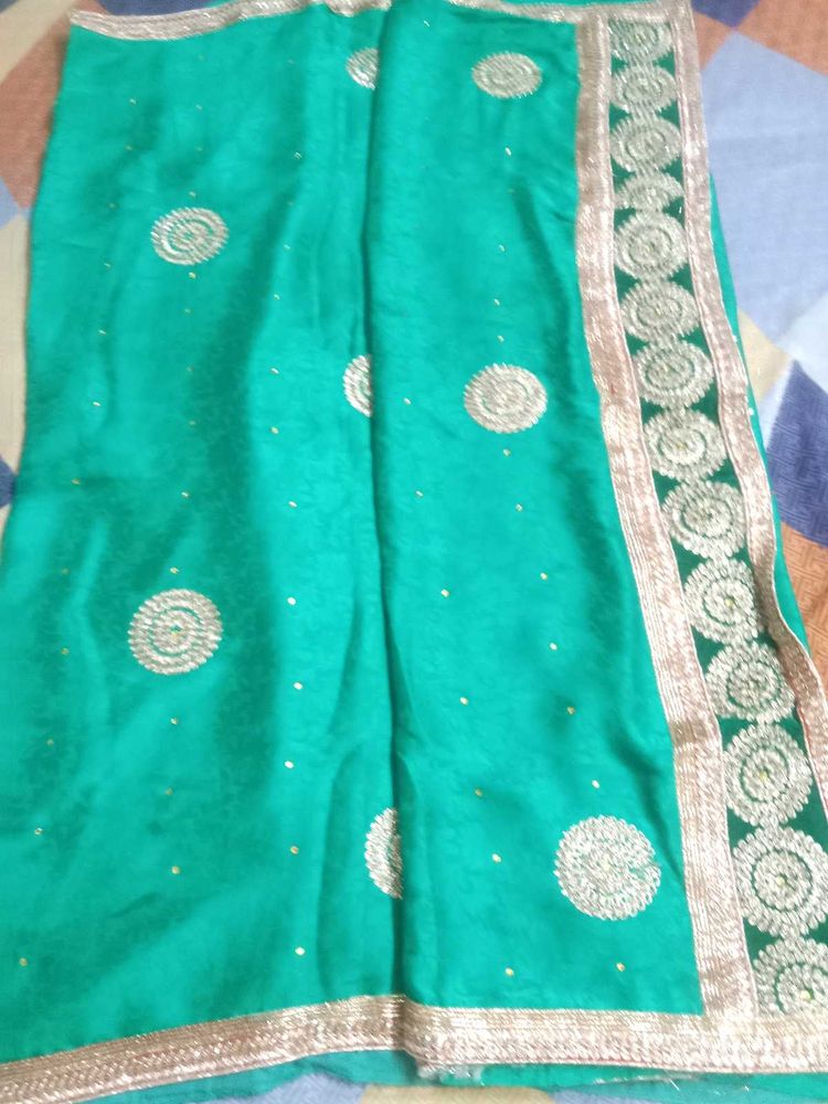 Elegant Green Saree with Golden Embroidery