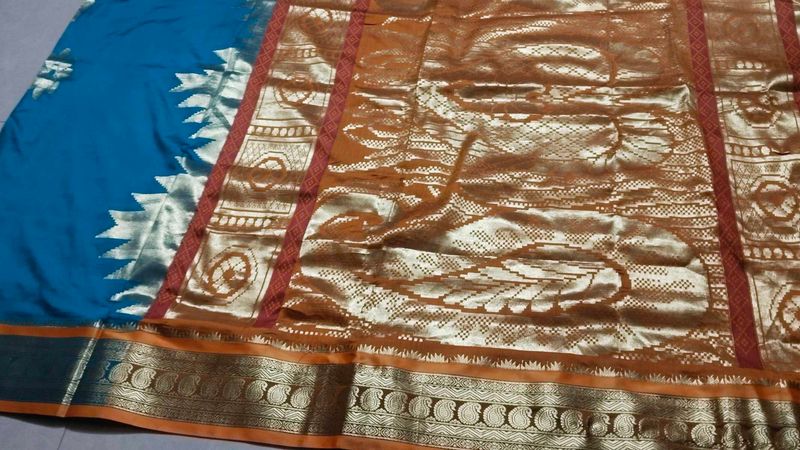 Elegant Teal and Gold Saree