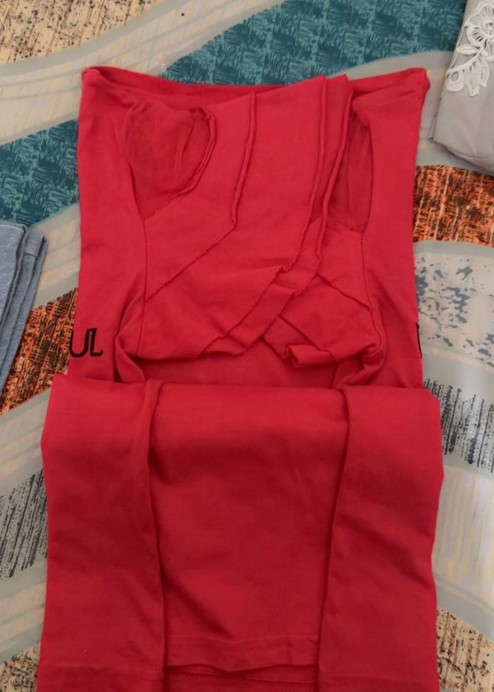 red tshirt eith some beeds