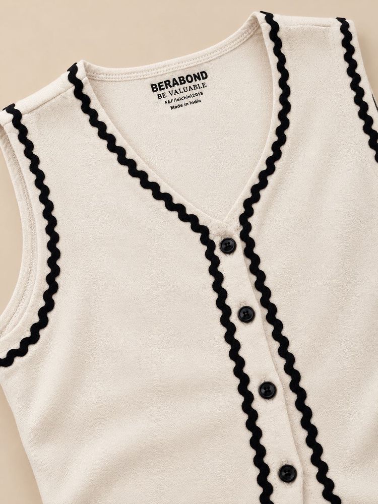 Cream Sleeveless Top with Black Trim