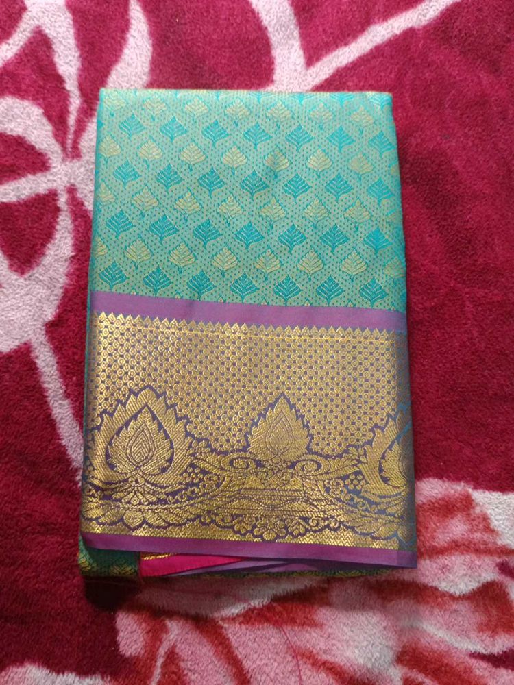 Beautiful Teal Saree with Gold Border