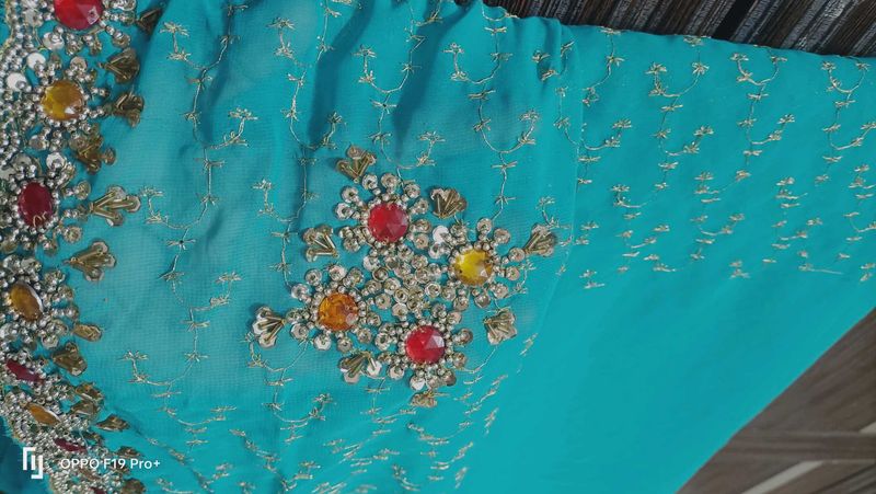 Stunning Embroidered Teal Saree