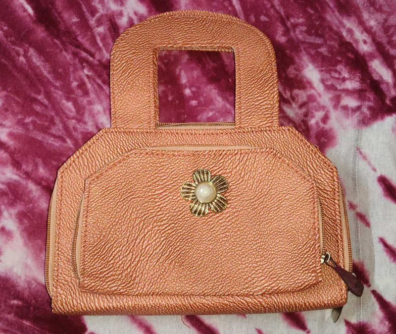 Chic Rose Gold Clutch with Pearl Accent