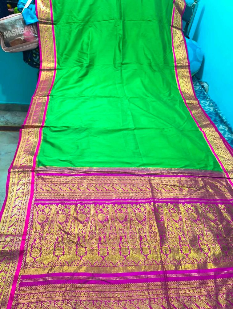 Vibrant Green Silk Saree with Pink Border