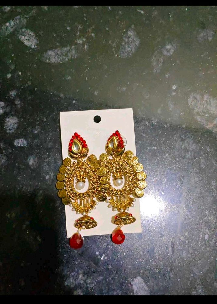 Golden Jhumka Earrings with Red Stone