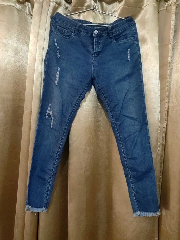 Distressed Blue Denim Jeans