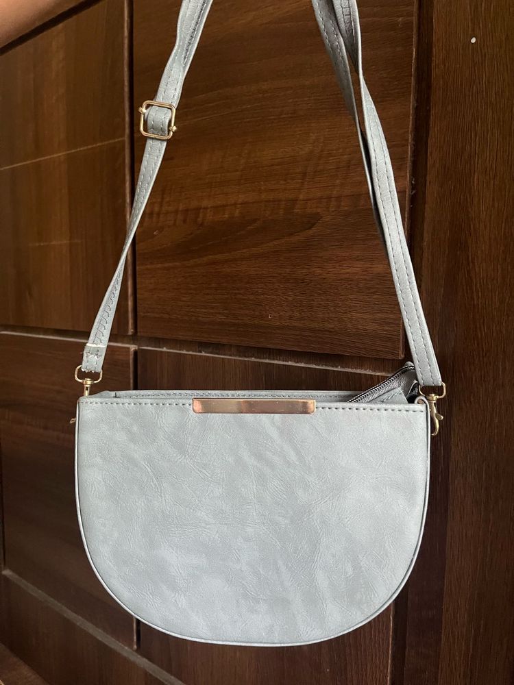Grey half moon sling bag