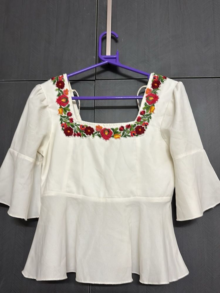 Floral Embroidered Peplum Top