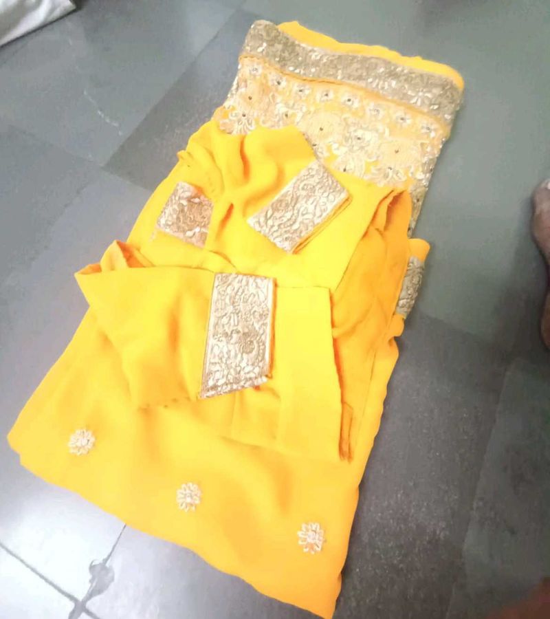 Vibrant Yellow Embellished Saree with stitched blo