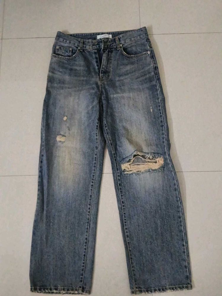 Distressed Blue Denim Jeans