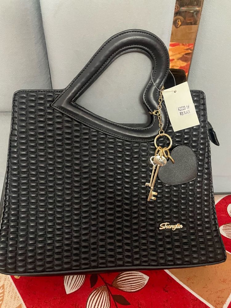Stylish Black Handbag with Heart Handle
