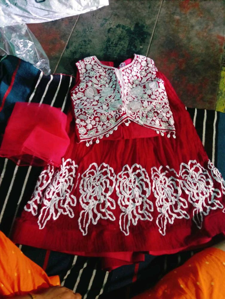 Elegant Red Lehenga Choli with Intricate Embroider