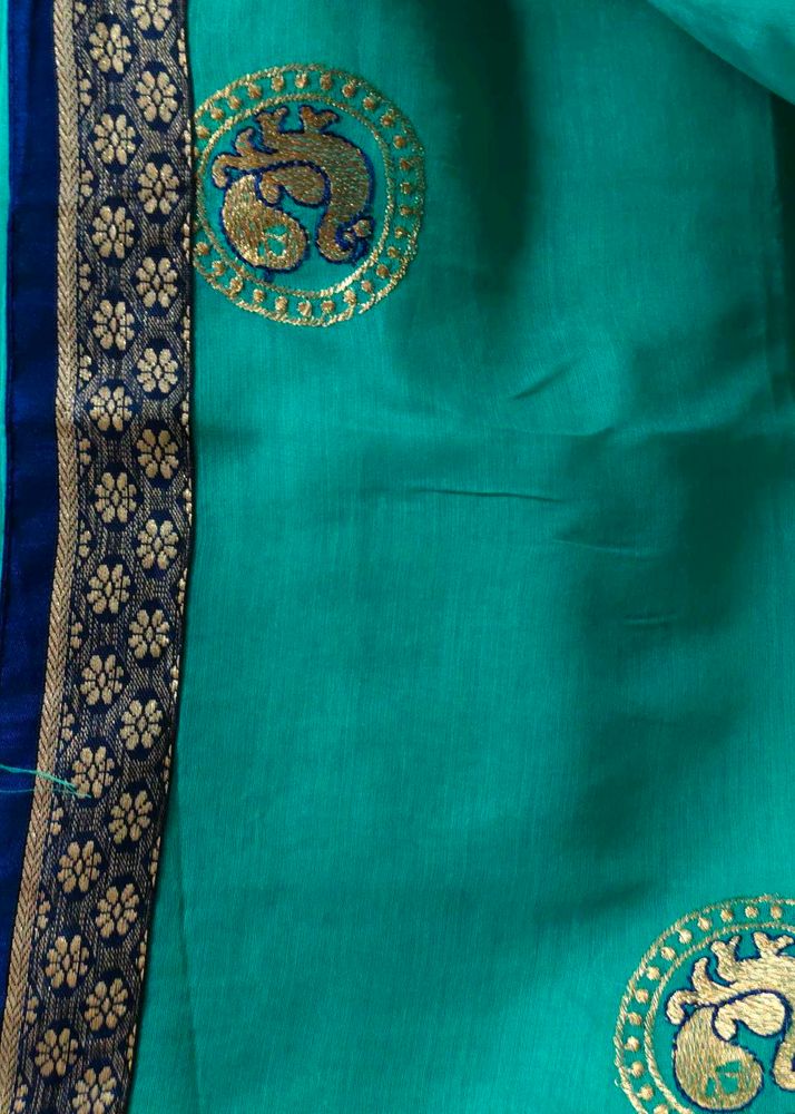 Elegant Teal Saree with Peacock Motif