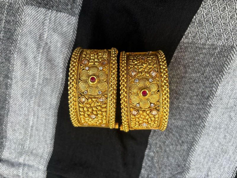 Traditional Gold Bangles with Intricate Floral De