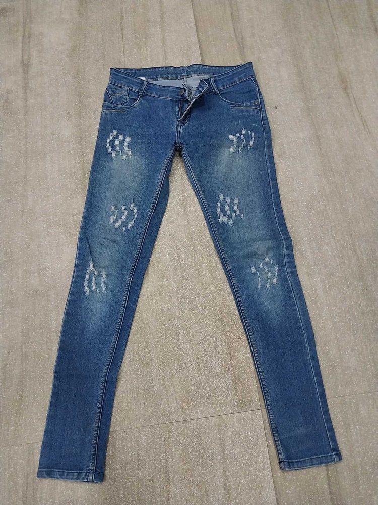Distressed Blue Denim Jeans