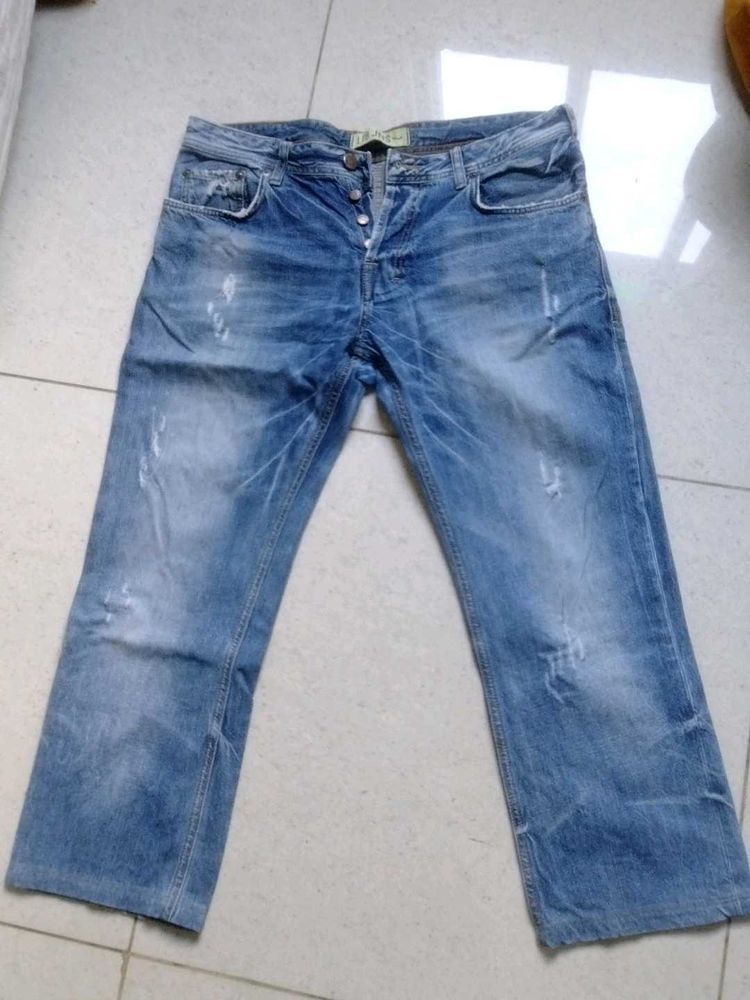 Distressed Blue Denim Jeans