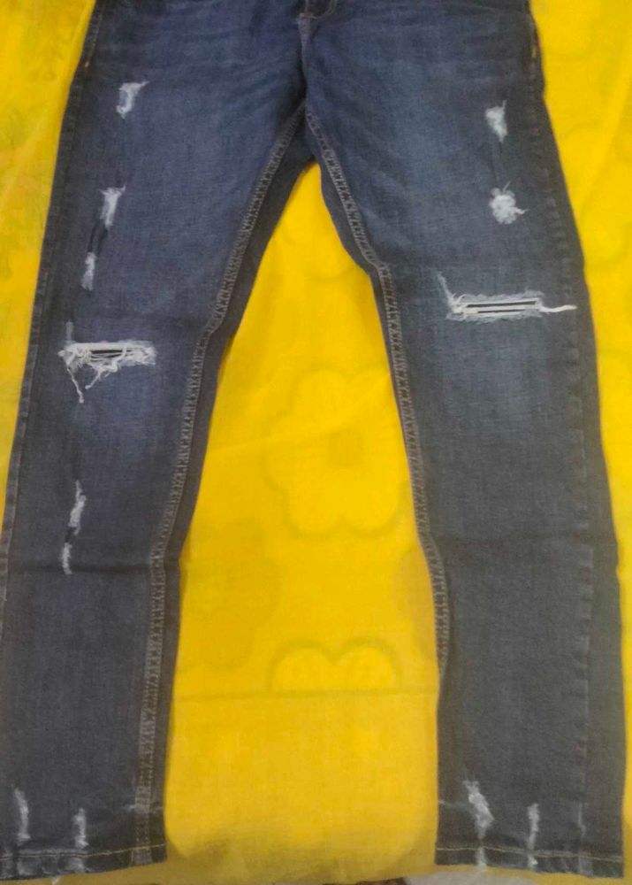 Distressed Blue Denim Jeans