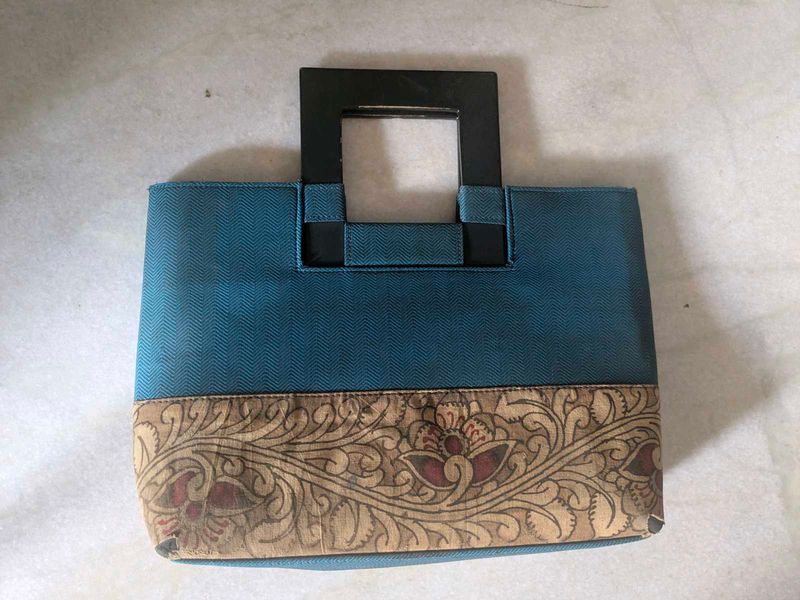 Unique Teal Handbag with Ornate Border