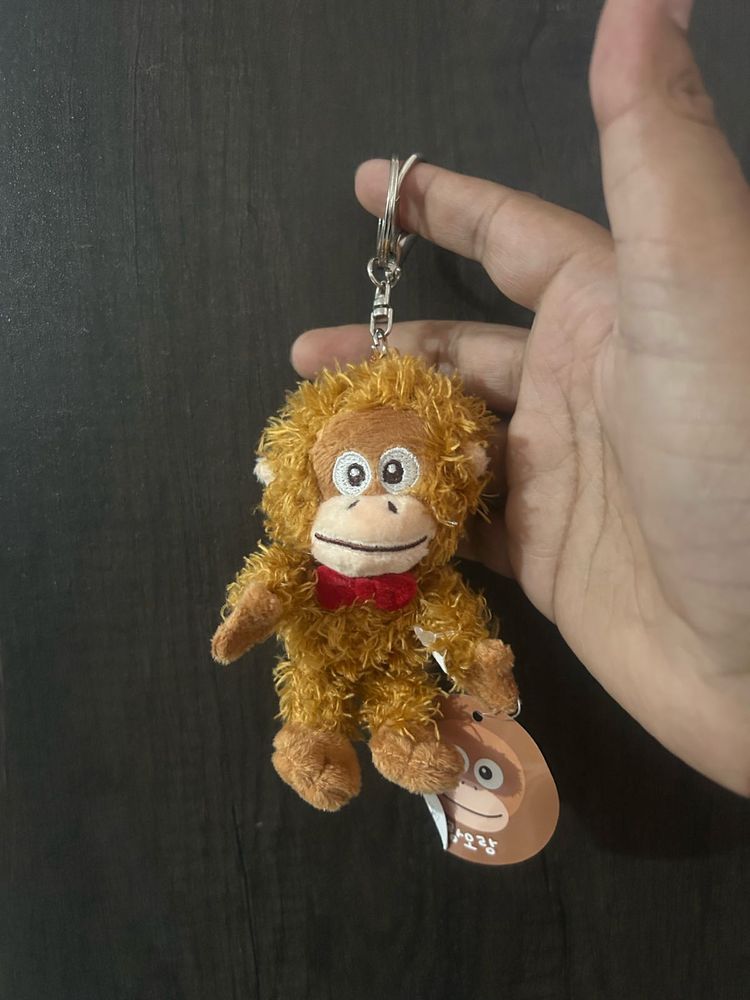 This is a fluffy orange-brown orangutan plush