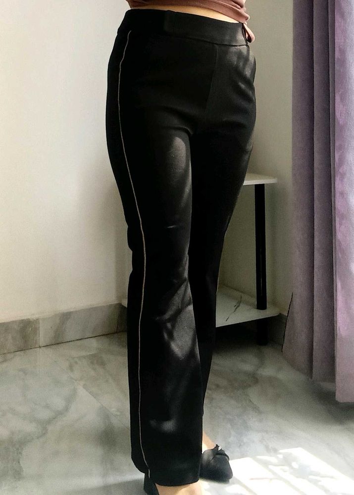 Chic Black Flared Pants with Subtle Stripe Detail