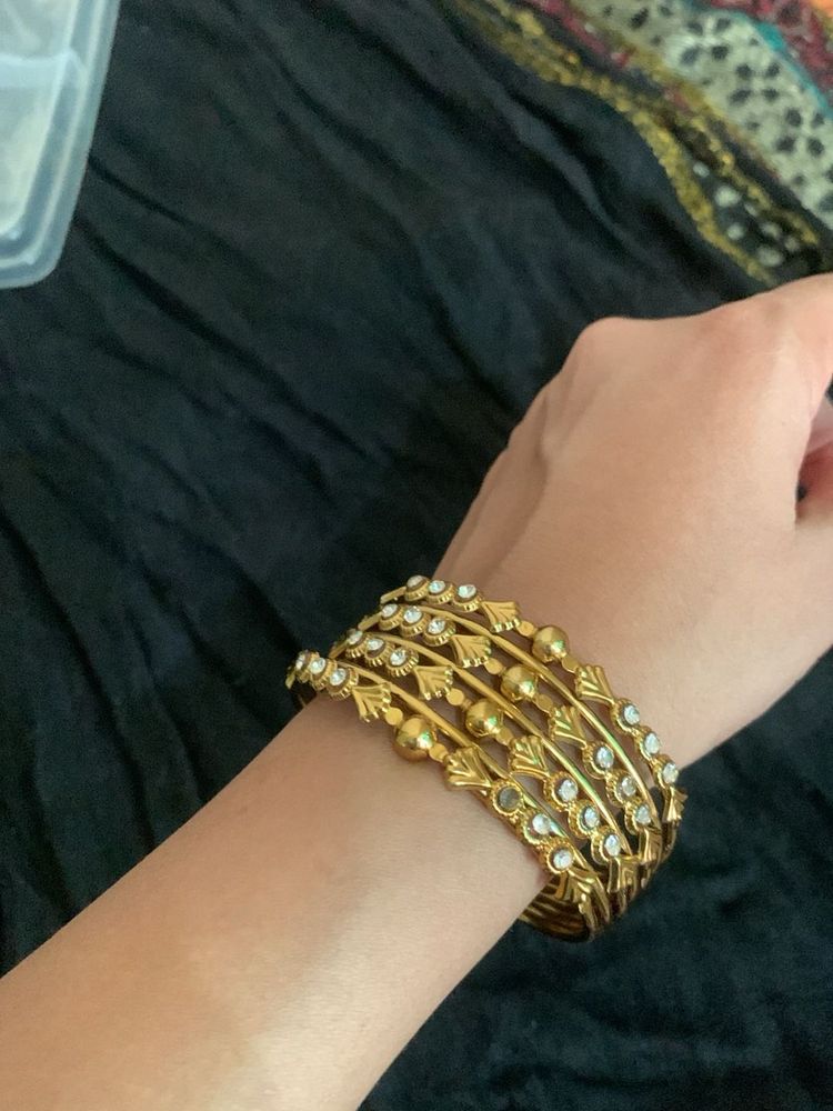 Elegant Gold Tone Bangles with Stones