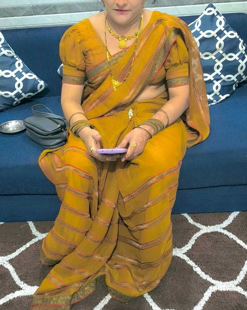 Elegant mustard heavy party wear saree with blouse