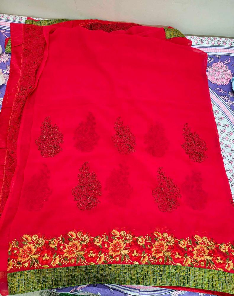 Rani Pink Embroidered Saree with stitched blouse