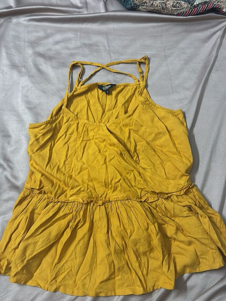 cute mustard sleeveless peplum top