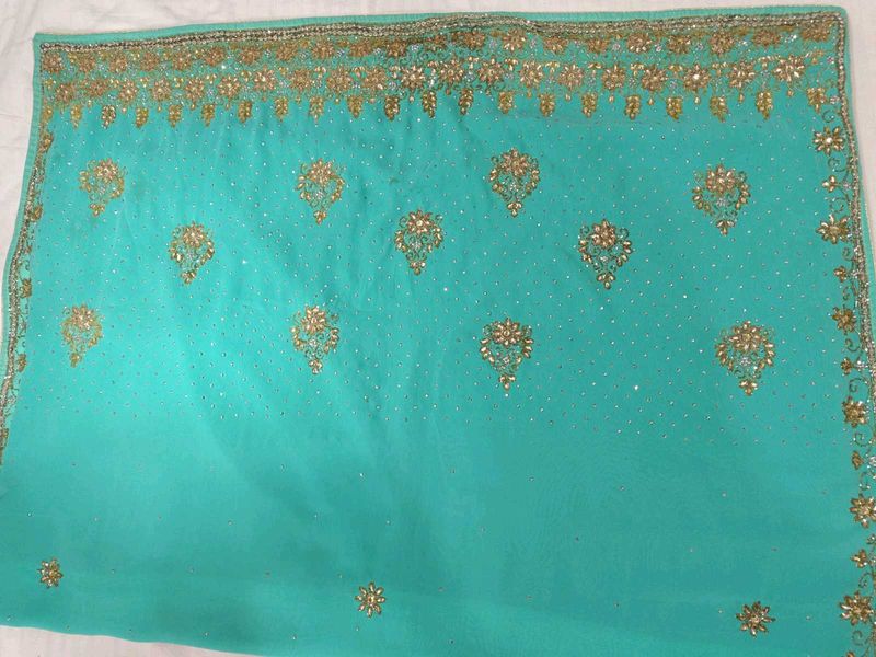 Exquisite Teal Saree with Golden Embellishments
