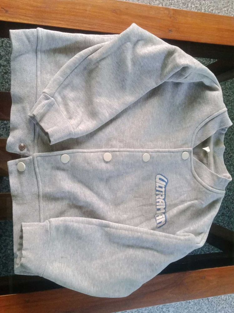 Grey Varsity Jacket.Waist 30 inch, Length 15 inch.
