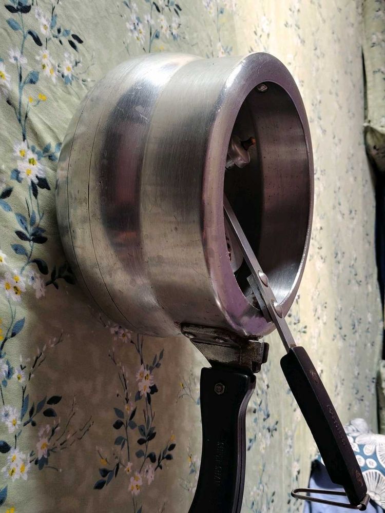 A silver pressure cooker