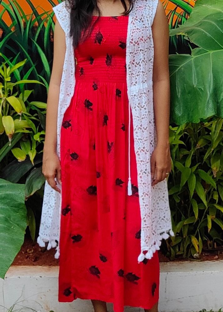 red coloured fit and flare dress with lace shrug