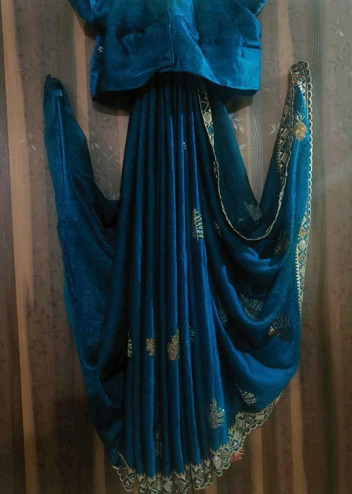 Elegant Teal Saree with Gold Embellishments