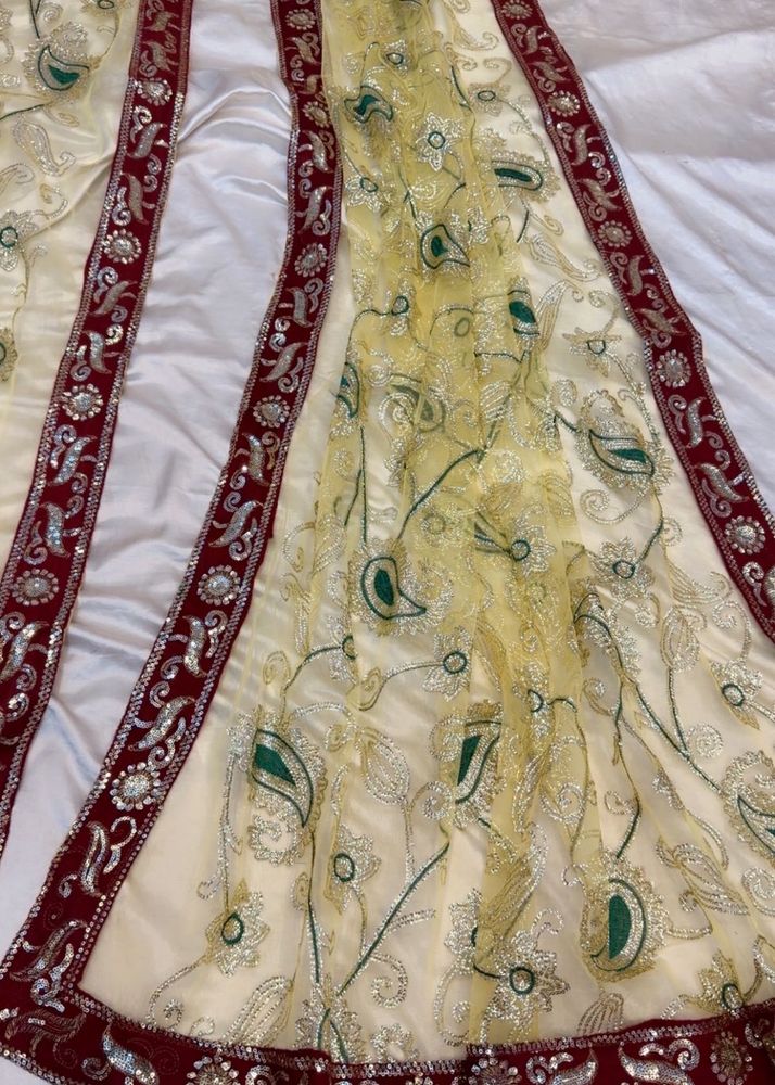 Exquisite Cream Saree with Peacock Motifs