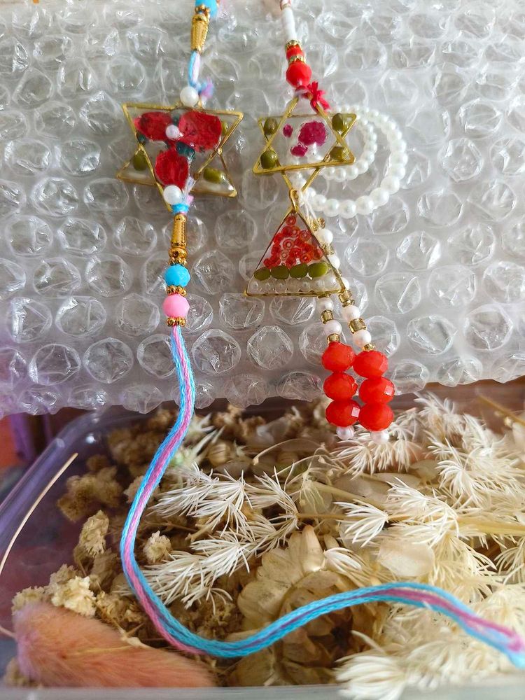 handmade resin couple rakhi