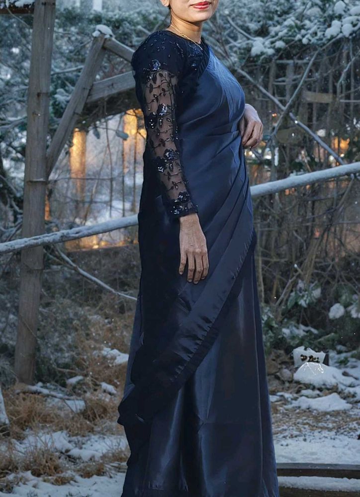 black saree with stiched blouse.