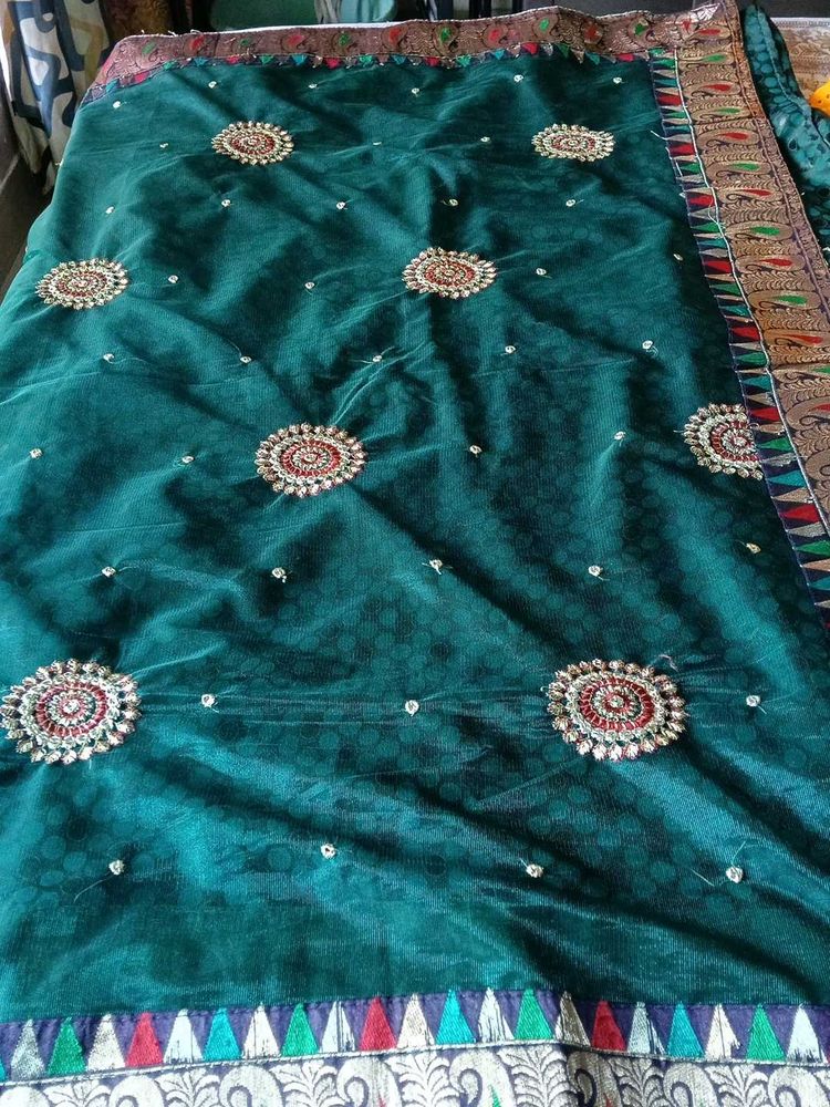 Elegant Teal Saree with Embellishments
