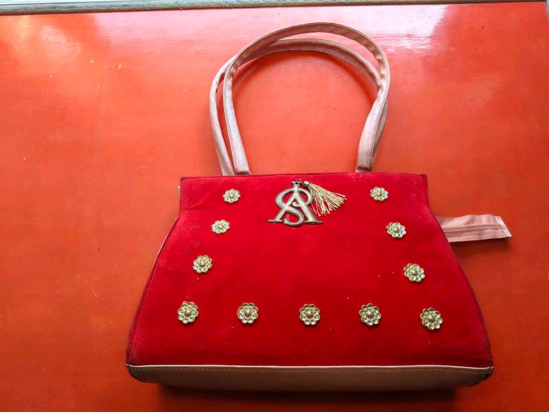 Red Velvet Handbag with Embellishments
