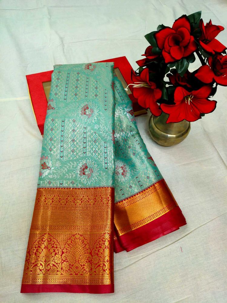 Elegant sea green Silk Saree with Gold Border